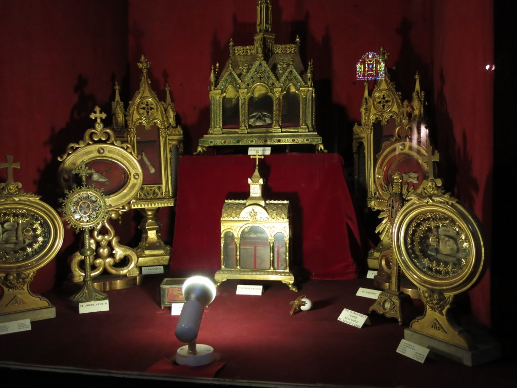 a display case full of relics from 25 different saints