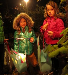 children at the door with their lanterns