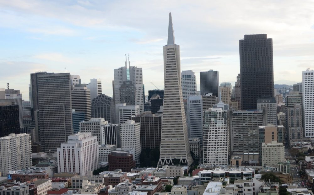 a view of downtown San Francisco seen from Coit Tower, with the Transamerica pyramid in the center. Lots of skyscrapers