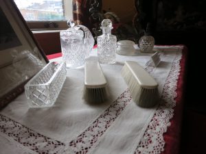 The dressing table holds glass bottles and brushes at the van Loon Museum in Amsterdam