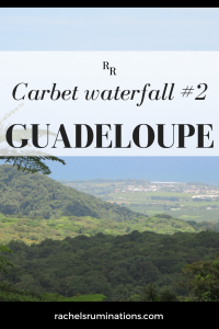 Pinnable image
Text: Carbet waterfall #2 Guadeloupe
Photo: long view over green  landscape with blue ocean in the distance.