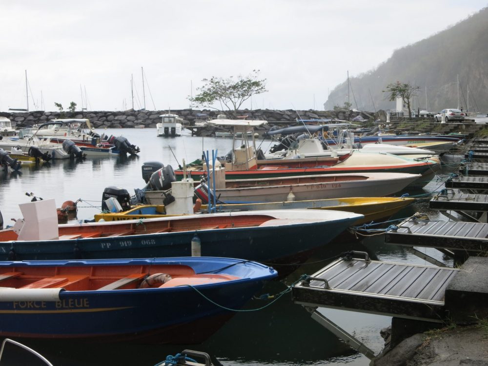 fishing boats moored in Deshaies, where Death in Paradise is filmed