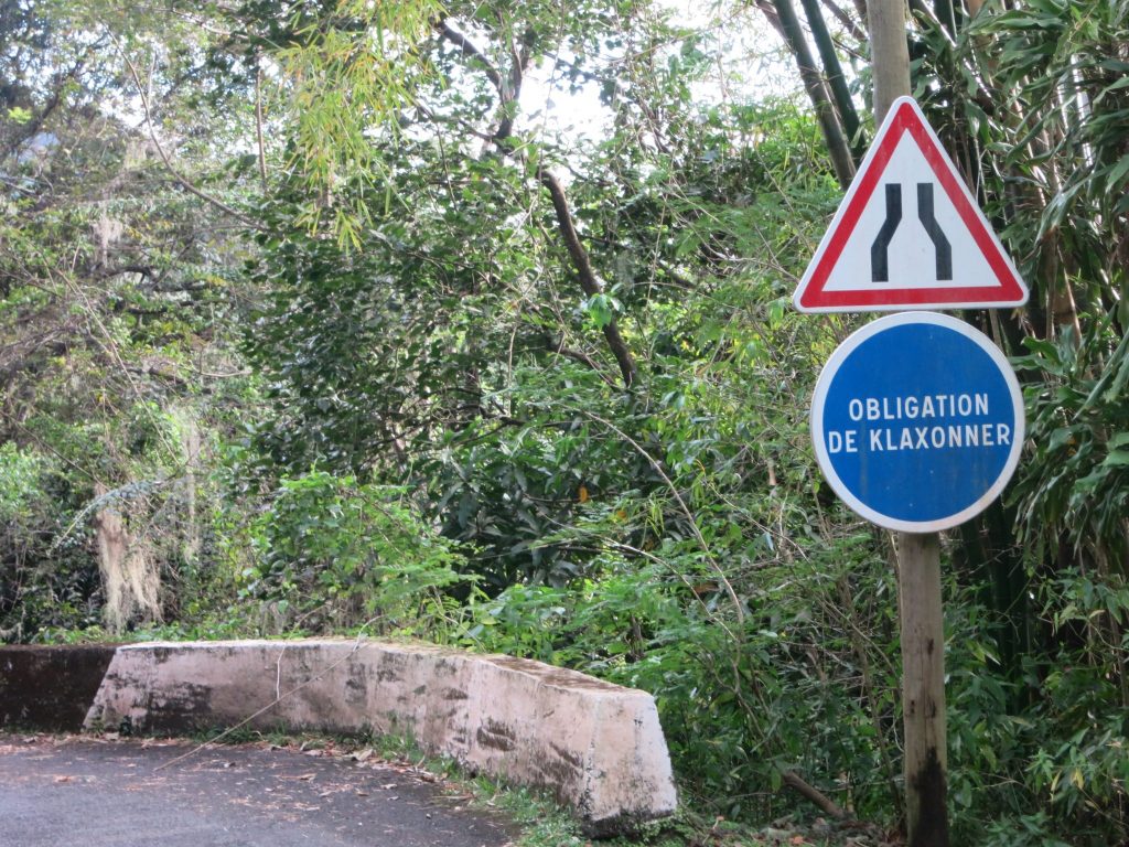 the sign saying that drivers are obliged to honk, on the way to the coffee plantation La Griviliere in Guadeloupe.