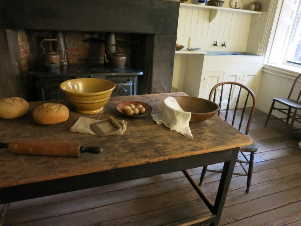 in Merchant's House Museum, a view of the kitchen showing the worktable and the oven hearth behind it