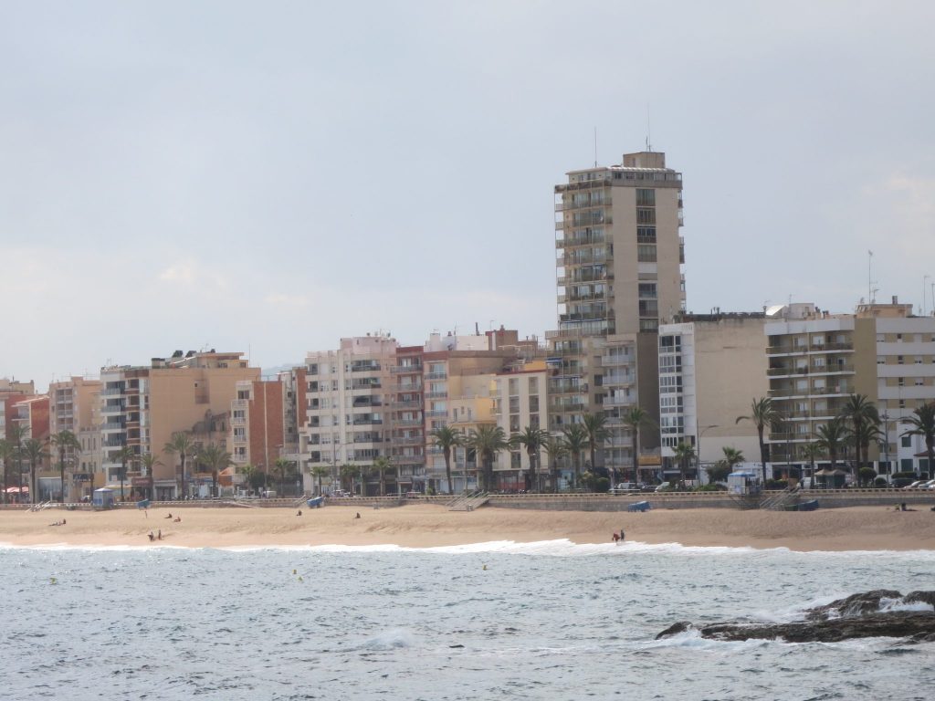 view of Lloret de Mar with a row of apartments and hotels on the beach