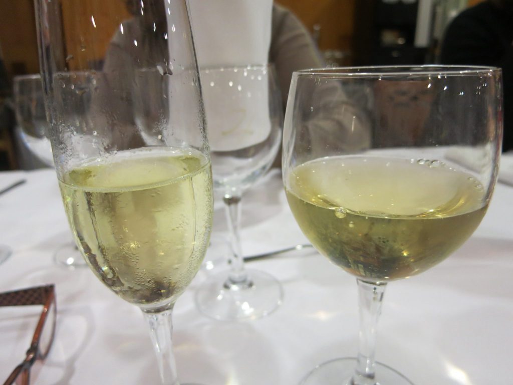 close-up of a glass of cava and a glass of wine