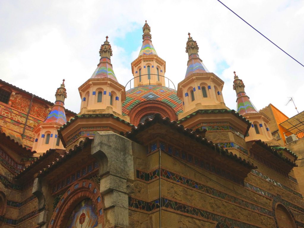 ornate towers with mosaics on the Church of Sant Roma in Lloret de Mar