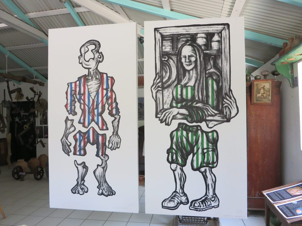 Two paintings of fragmented human forms in Kreol West Indies