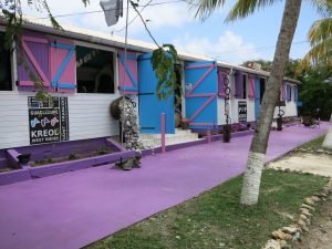 the purple and blue painted exterior of Kreol West Indies