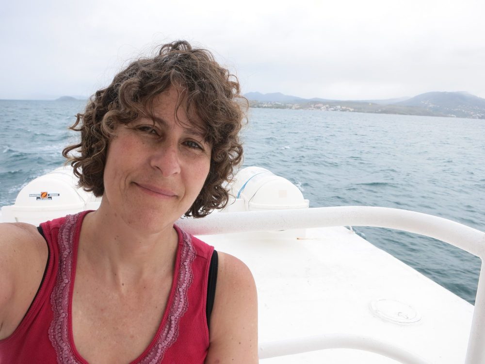 a solo travel selfie taken on a boat