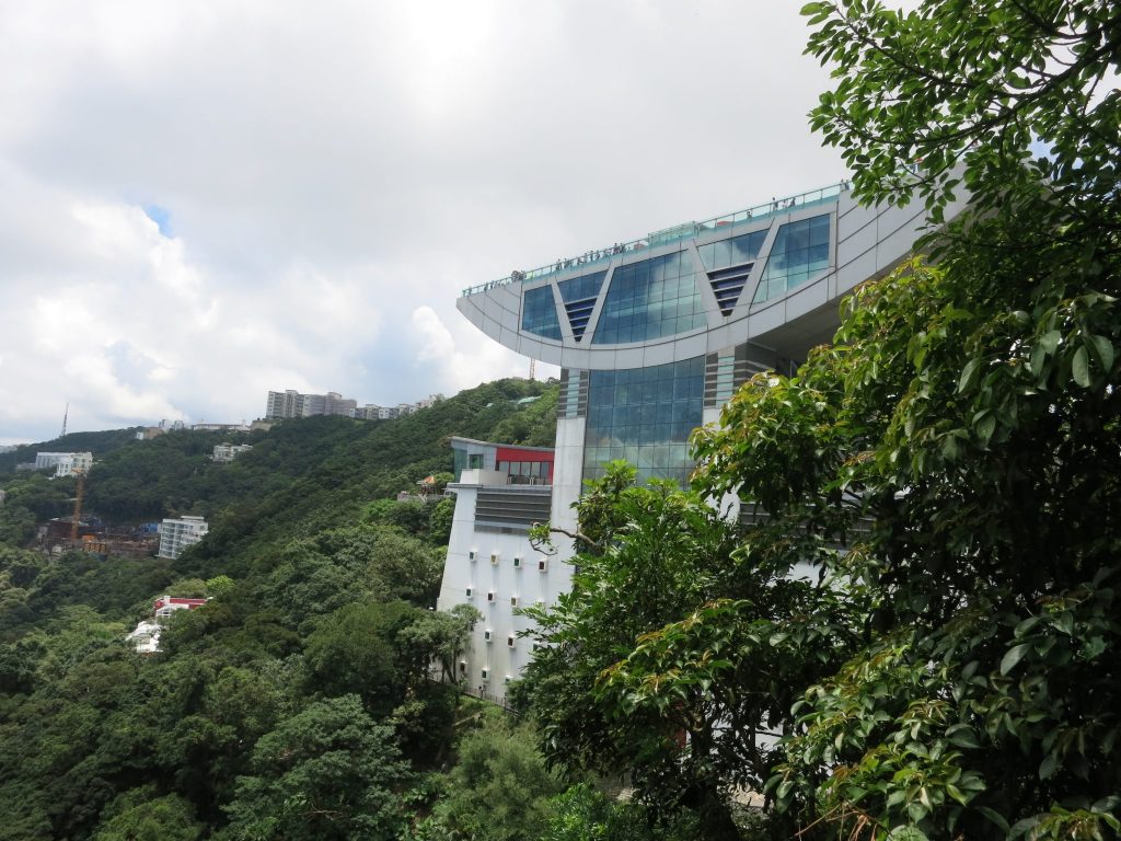 anvil-shaped building with a huge roof on Victoria Peak