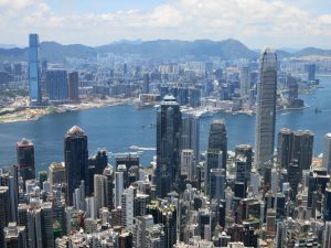 the skyscrapers of Hong Kong and Kowloon and the waterway between them, seen from Victoria Peak