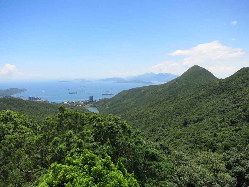 forest-covered hills with the sea in the background, as seen from the Circle Path on Victoria Peak