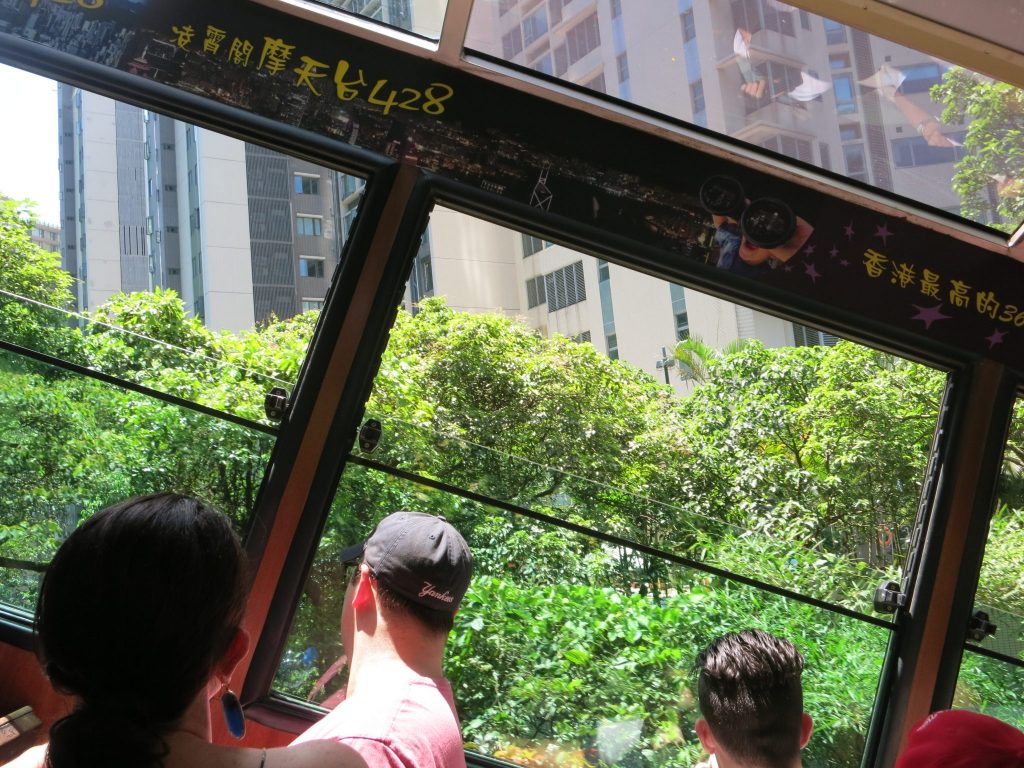 buildings seen from the tram show how much the tram is tilted as it descends Victoria Peak