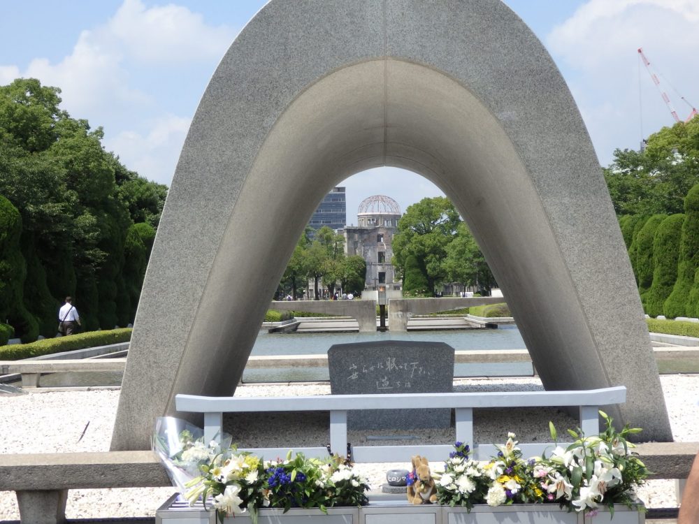 the Cenotaph with the Atomic Bomb Dome in the background in Hiroshima