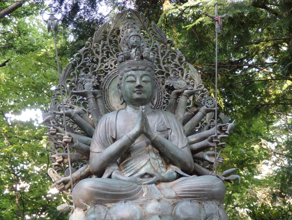 one of many god and goddess statues on the path to the shrine at Engyoji: this one, besides his/her arms that are folded as if in prayer, has perhaps 15 more arms arrayed behind him/her, each holding a different item.