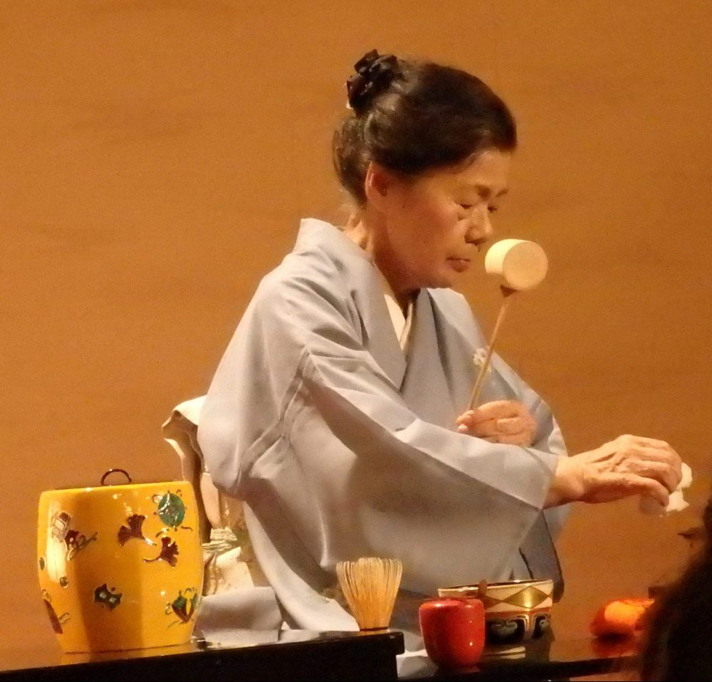 woman in a kimono performs the tea ceremony, in Gion Corner