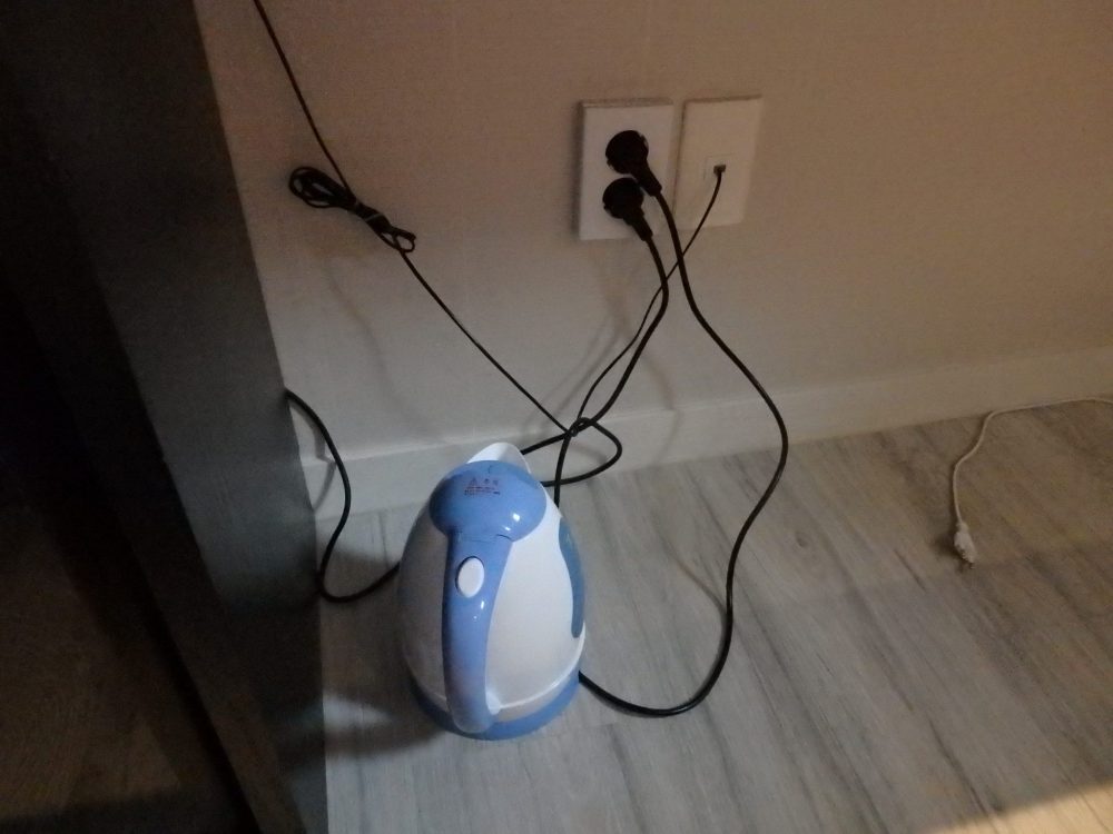 the kettle at the New Suwon Hotel on the floor under the desk