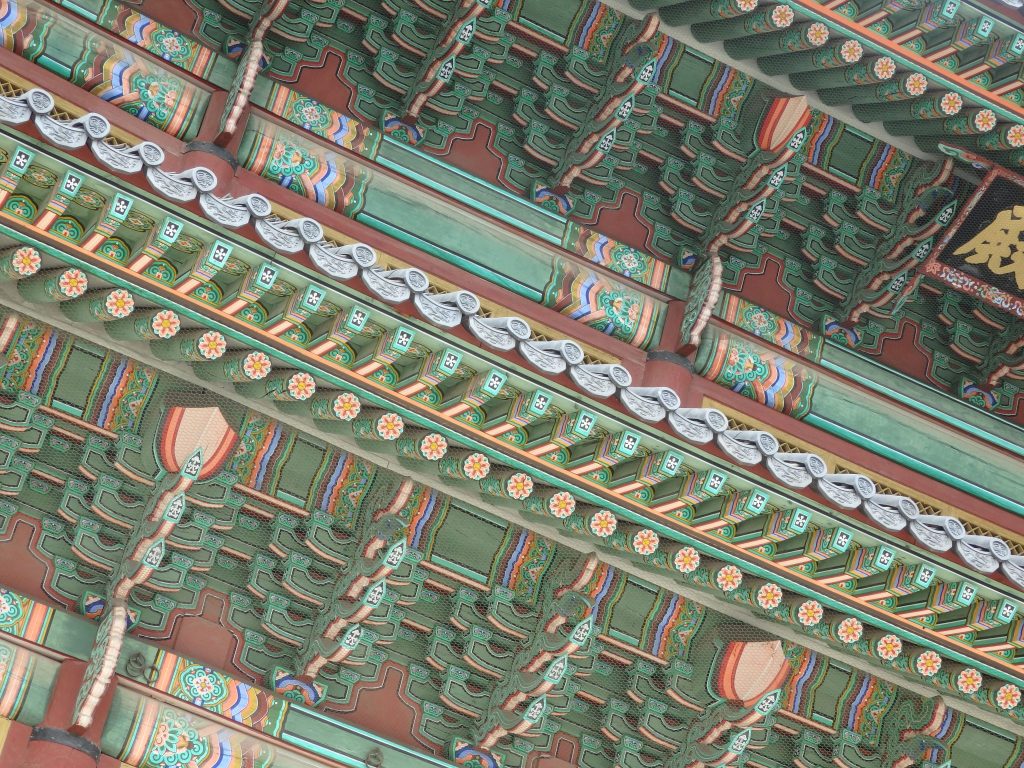 the eaves of many of the Changdeokgung Palace buildings in Seoul, Korea, are painted in very fine detail with decorative patterns.