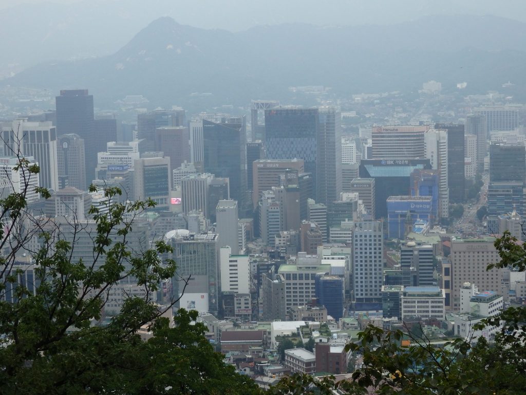 a hazy view of Seoul from the base of Seoul Tower