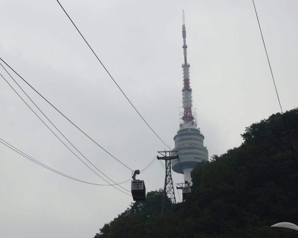 the cable car with Seoul Tower in the background
