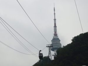 the cable car with Seoul Tower in the background