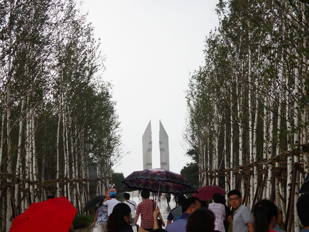 The Baengma Battlefield Monument, seen from the distance down the line of birch trees, near the DMZ.