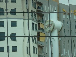 The Valor factory's sign, reflected in the factory building