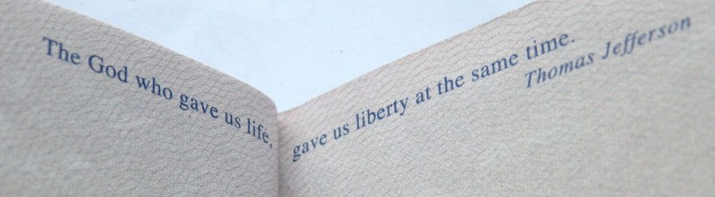Text from a US passport: "The God who gave us life, gave us liberty at the same time" Thomas Jefferson
