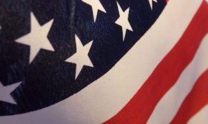 close-up of the American flag, representing the American Dream