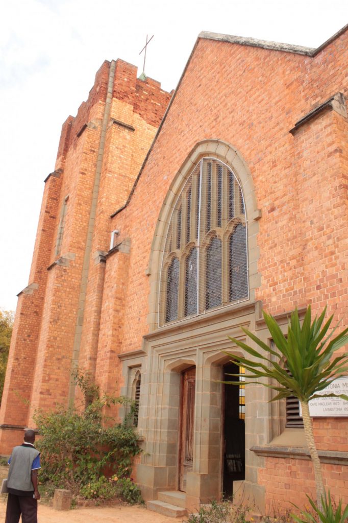 The photo shows just the front of LIvingstonia church: red brick, with an arched stained glass window above the entrance.