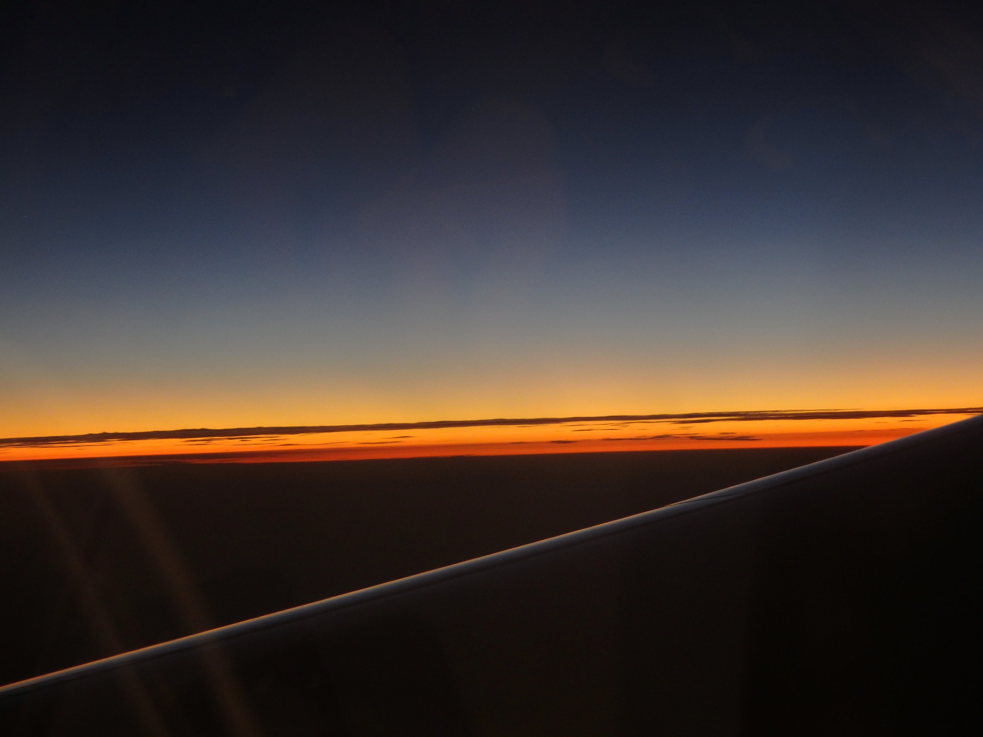 sunset as a pilot and passengers might see it from a plane