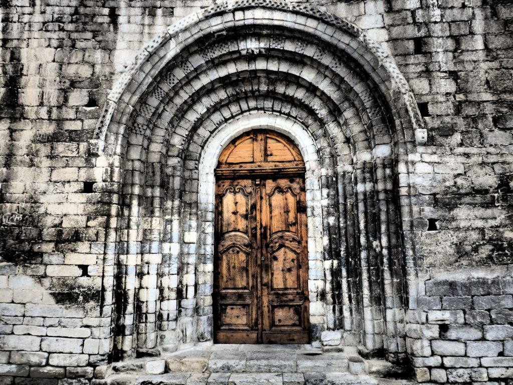 entrance archway to the Santa Maria church in Arties, Val d'Aran, Spain