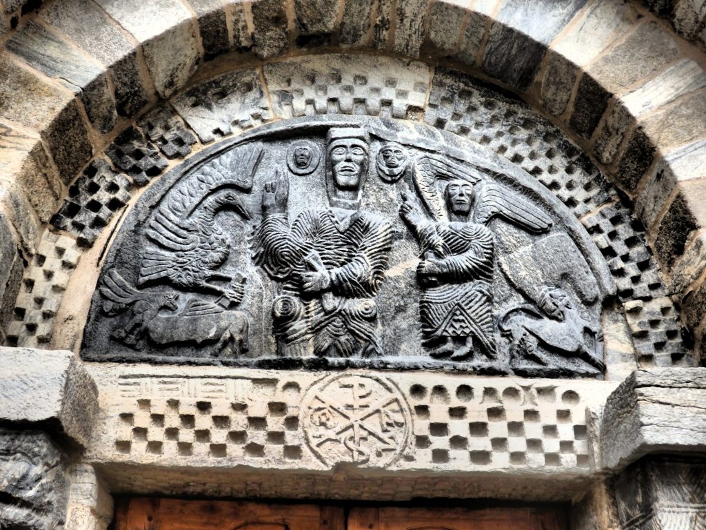 A more sophisticated medieval carving above a doorway on the church of Santa Maria in Bossòst in the Val d'Aran, Spain.