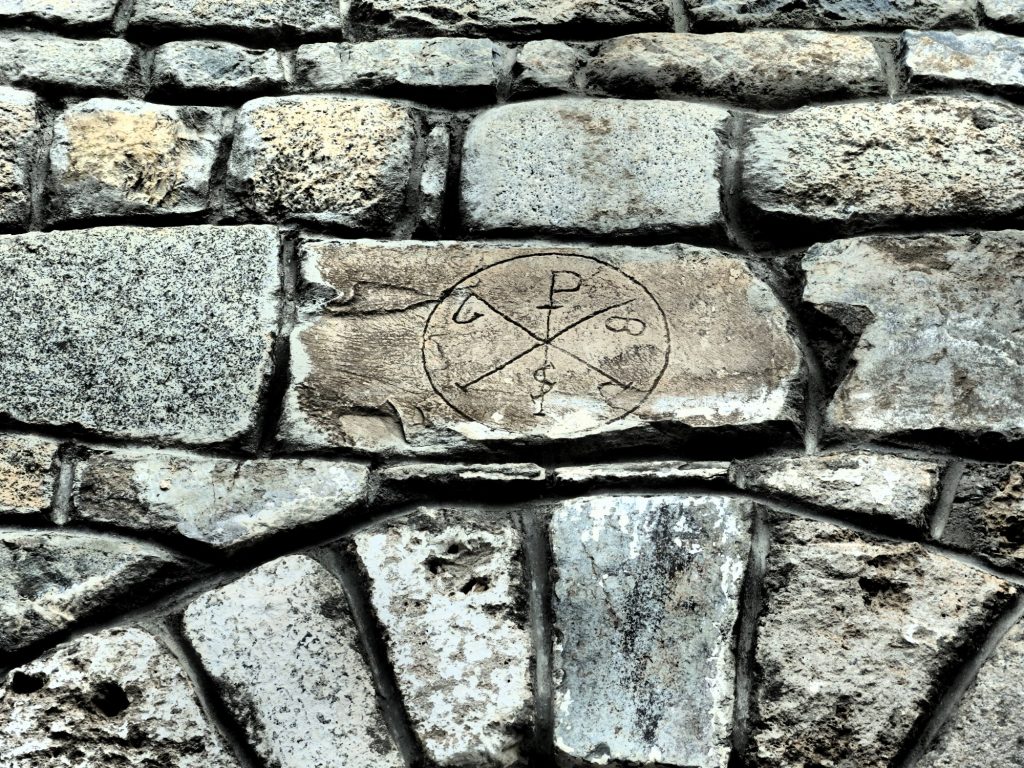 I spotted this symbol on several of the churches in the Val d'Aran, Spain. In this case it's a very shallow carving, as if it was an afterthought or graffiti.