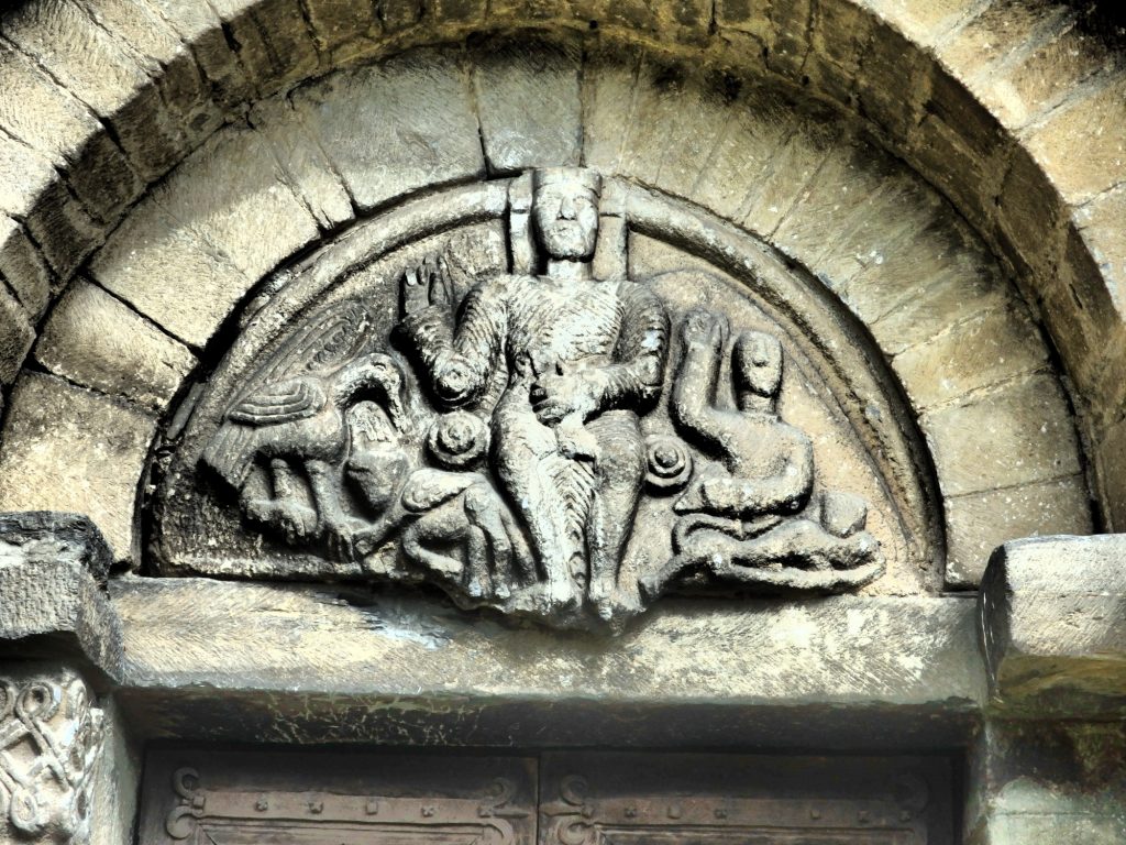 carving above the door of Sant Felix in Vilac, Val d'Aran, Spain