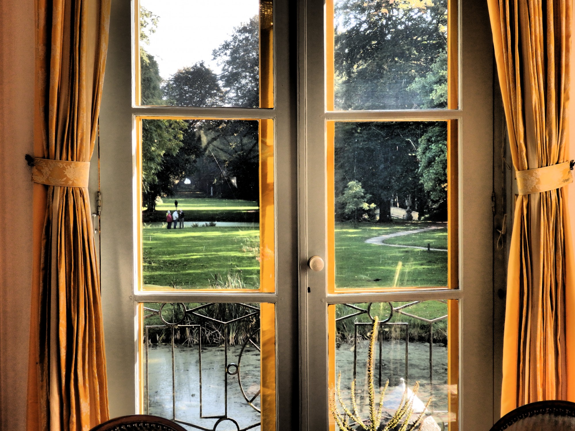 the view down the length of the garden as seen from inside the house, in Fraeylemaborg, Slochteren, the Netherlands