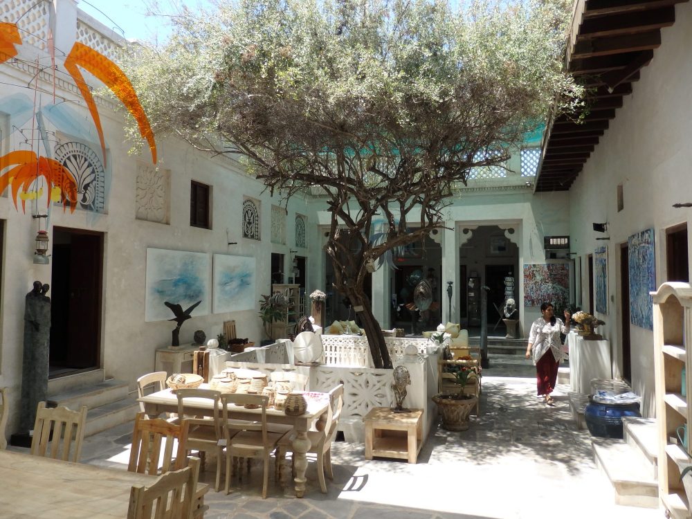 the tree-shaded, art-filled inner courtyard of the Majlis Gallery in Old Dubai