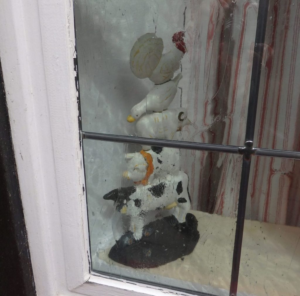 I spotted this image of the town musicians of Bremen in the window of a very old half-timbered house in Schnoor.