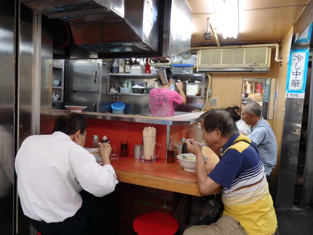 Hole-in-the-wall restaurants in Tokyo, like this one, open to the street, serve delicious, filling food.