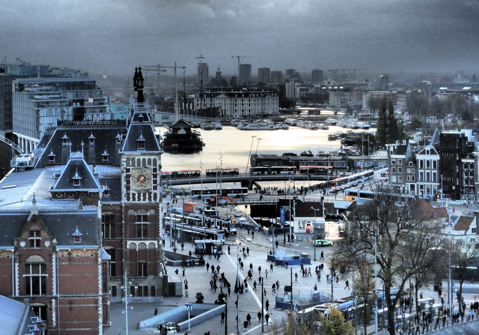 This picture shows Amsterdam Central on the left, and the plaza with tram stops in front of it.