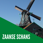 Text: Zaanse Schans Image: looking up at a windmill.