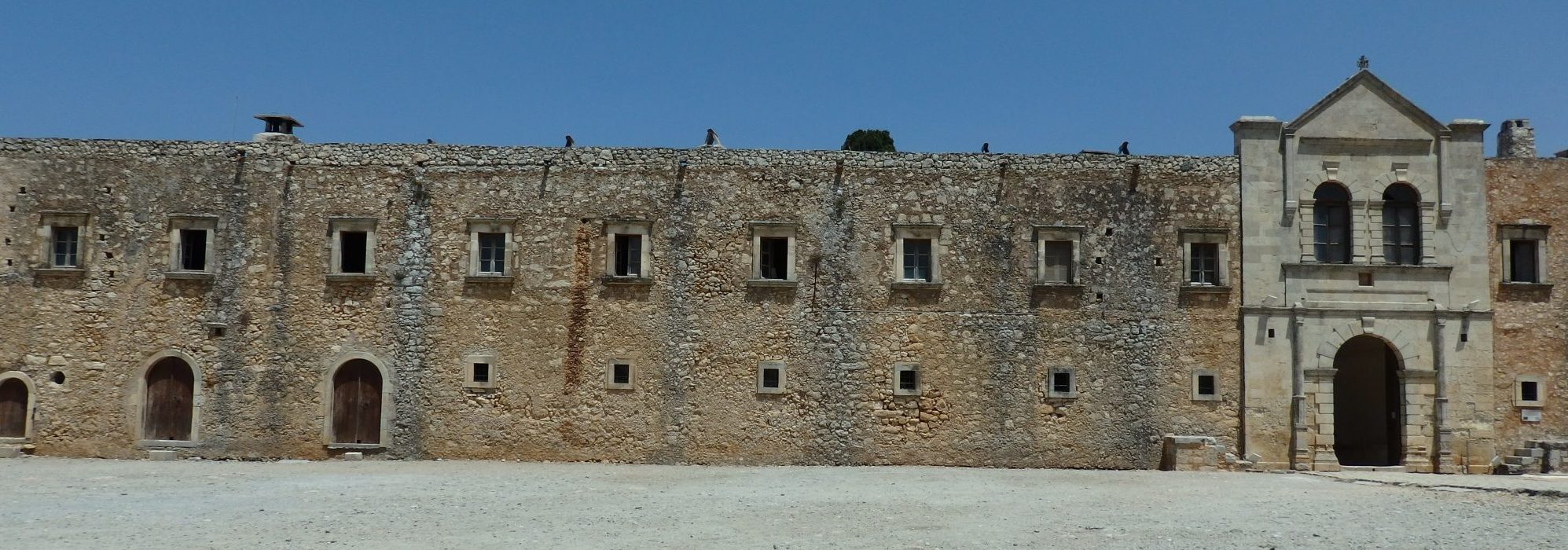 a section of the outer building enclosing the courtyard of Arkadi monastery