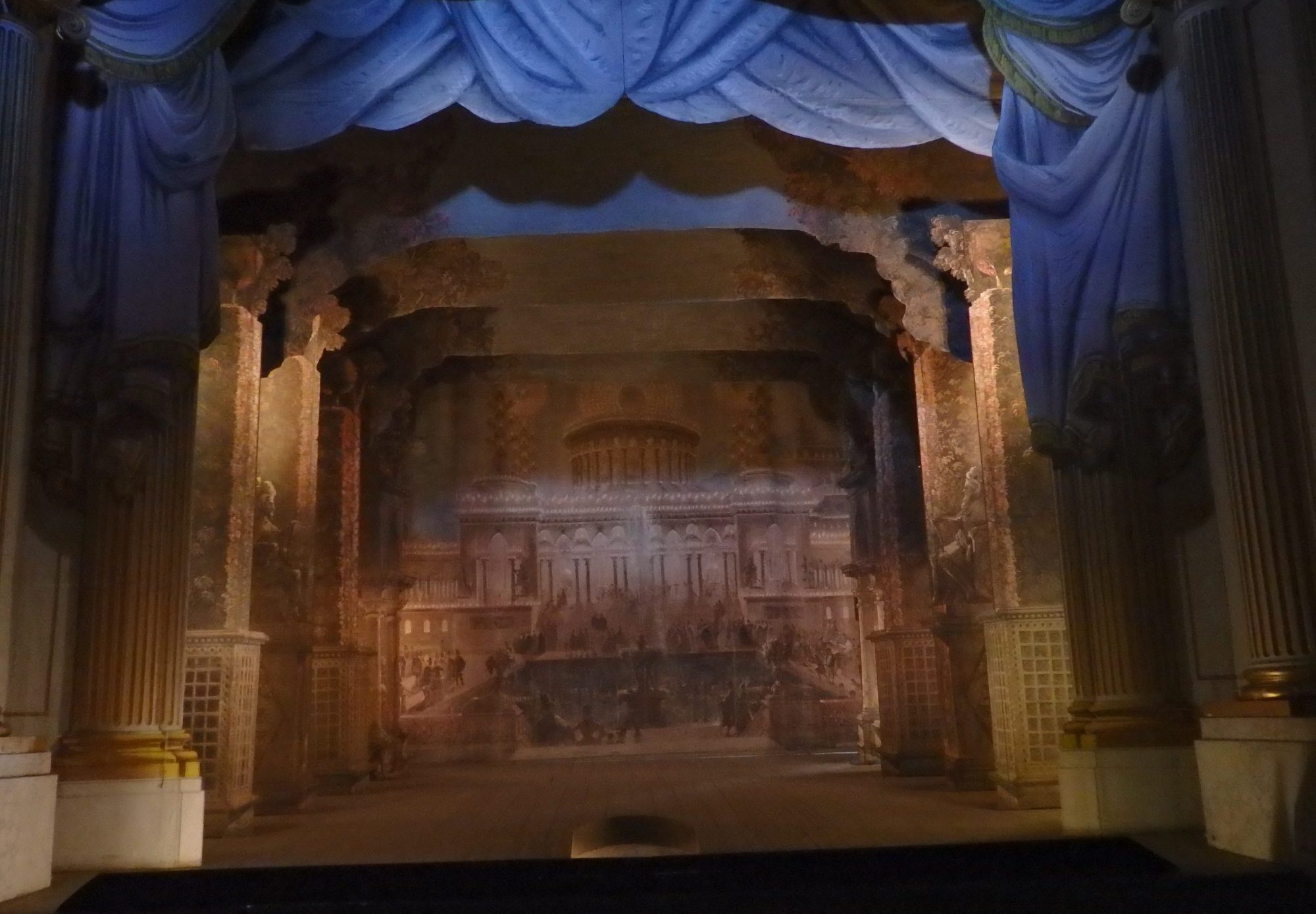 An old-fashioned theater with painted sets.