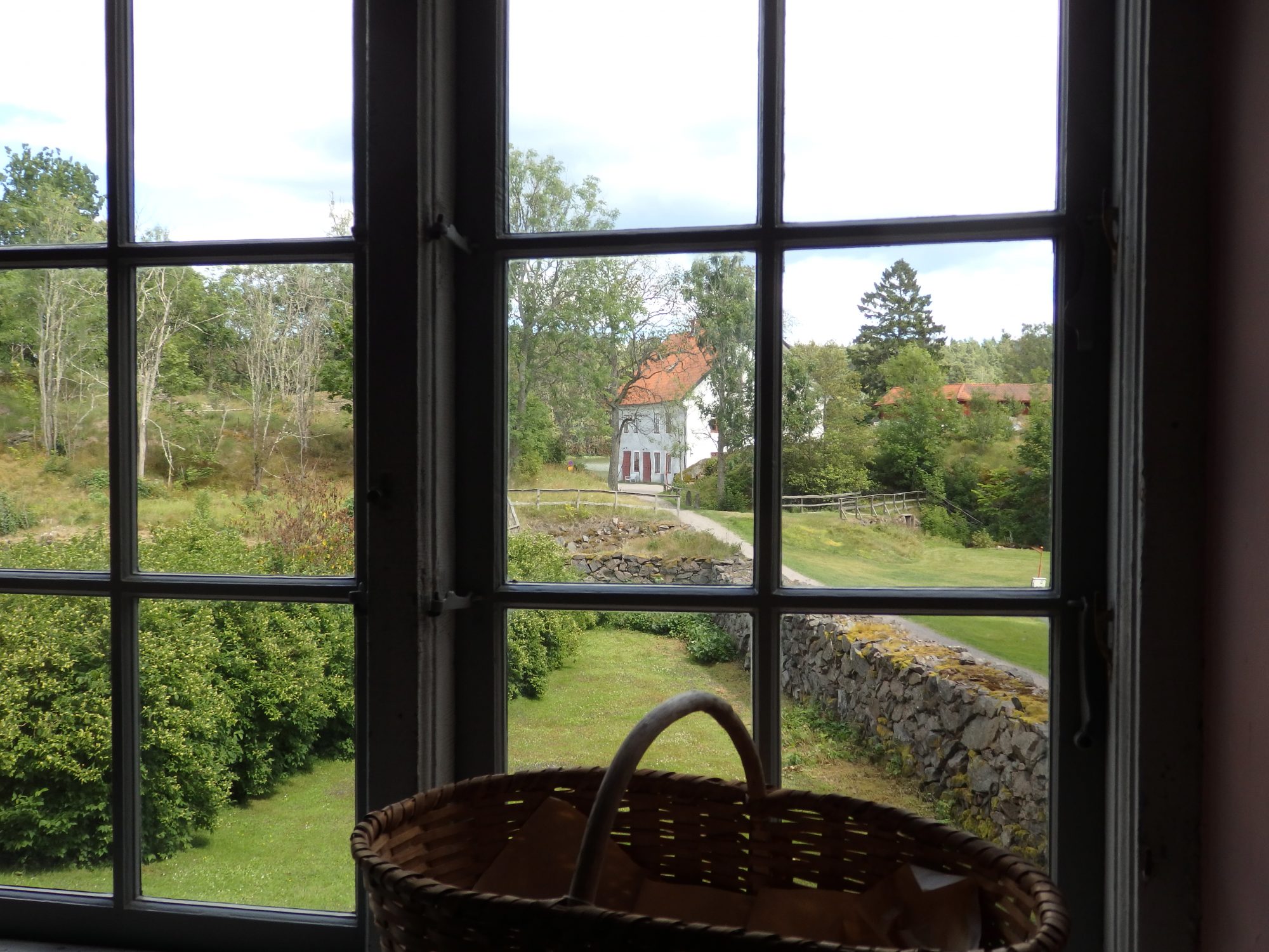 a view of the distillery building from the main manor house of Nynäs