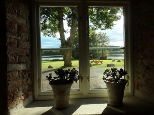 a view out of the main building toward the lake at Öster Malma