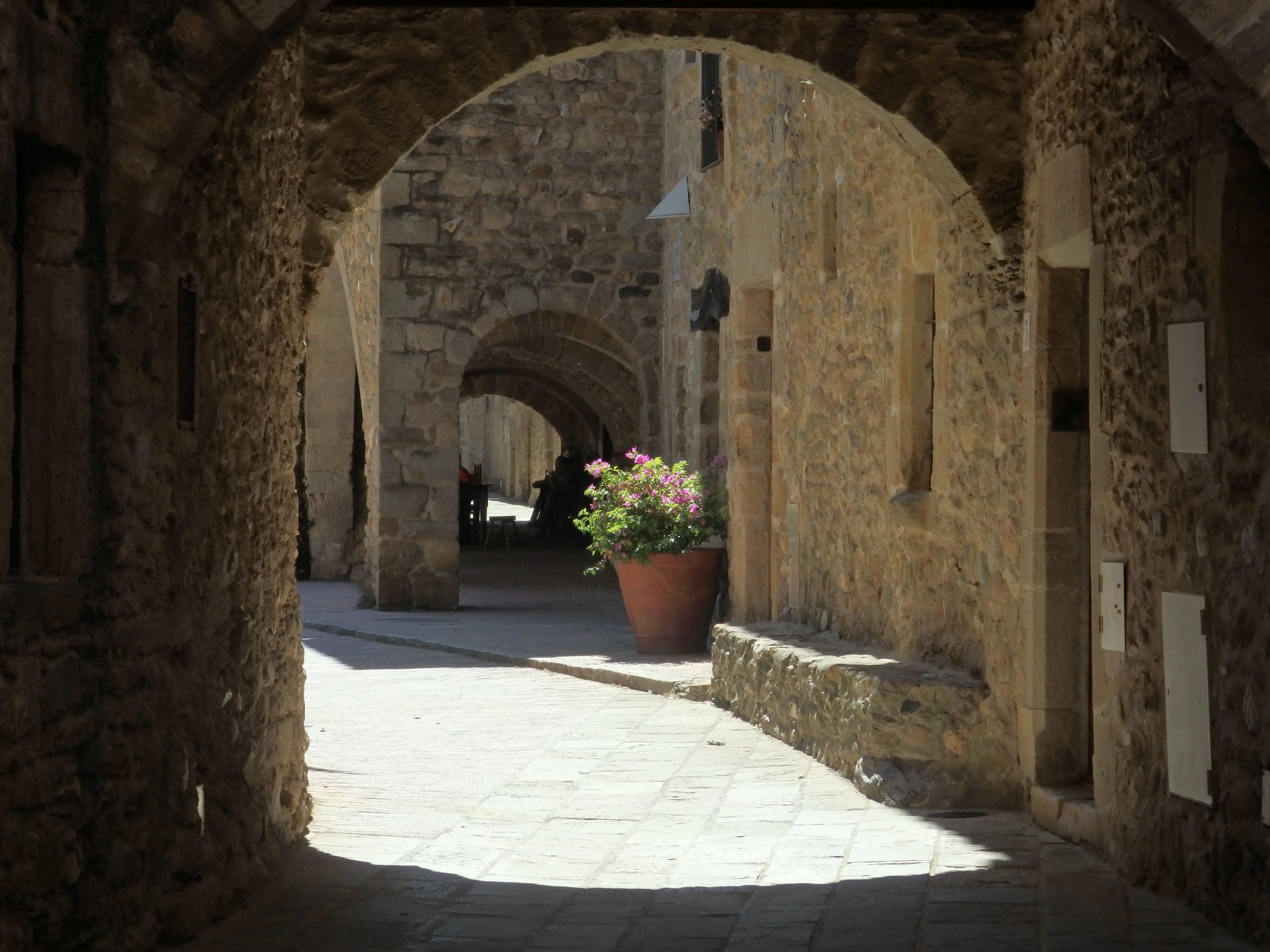 Archways provide shade in Monells,, in the Baix Emporda,, Spain