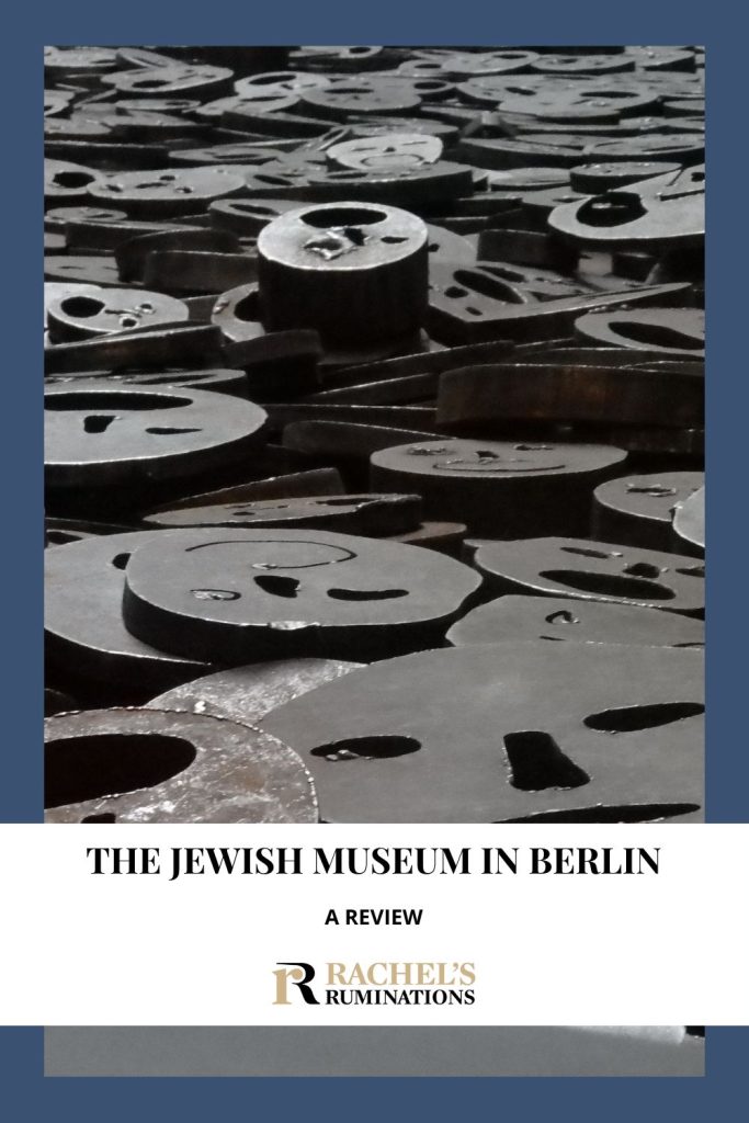 Text: The Jewish Museum in Berlin: A review. Image: metal faces from the Memory Void in the museum.