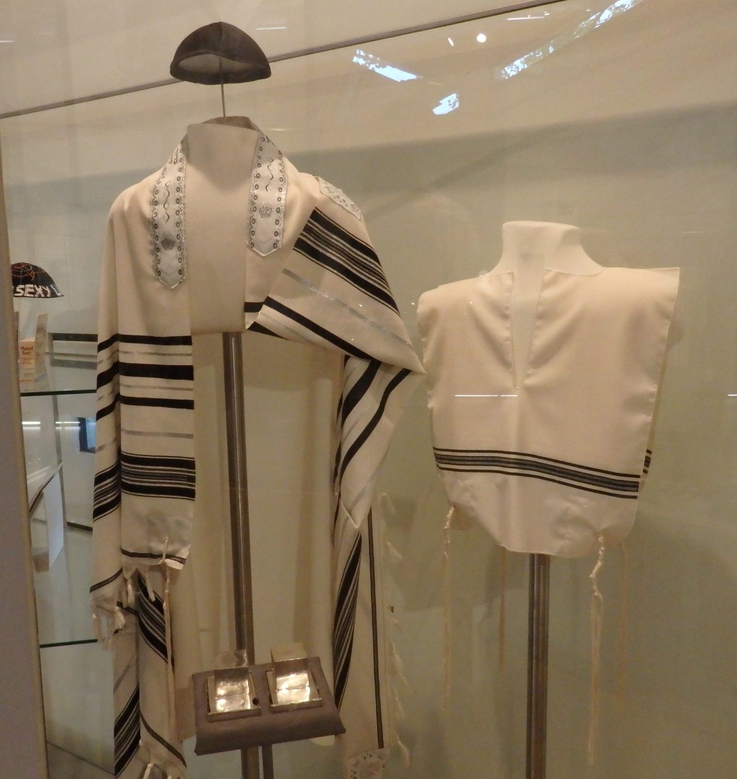Jewish prayer shawls, called tallit. The museum includes explanations of Jewish culture and tradition, as well as tracing how it changed over time. Jewish Museum Berlin