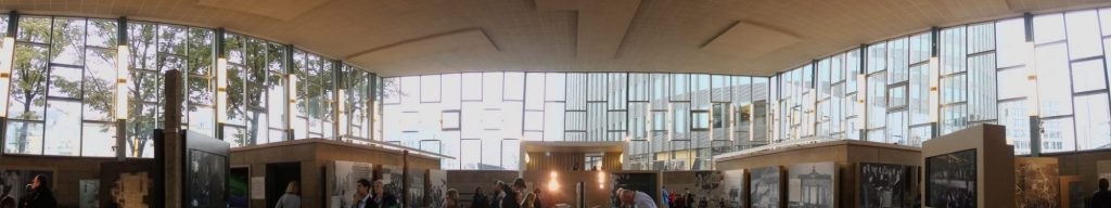 Widely spaced structures along the bottom, but the photo mostly shows the walls of windows from end to end.